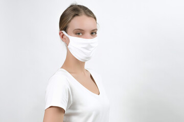 Young beautiful white woman wearing face mask, health protection in prevention for coronavirus, covid-19