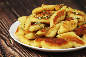 Polish dish kopytka served at the table