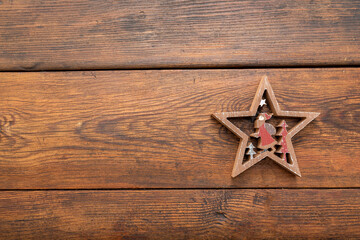 tree figures, Christmas stars on oak table