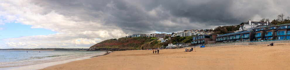 Fototapeta na wymiar Coastal Landscape in Carbis Bay, Cornwall on a stormy, overcast day. Ultrawide panoramic.