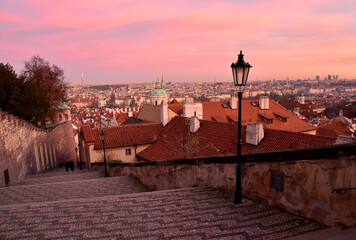 Old Prague street at sunset stock images. Ancient architecture in Europe. Evening Prague old town. Old castle stairs Prague at sunset photo. Mysterious Prague images. Ancient street in Czech Republic