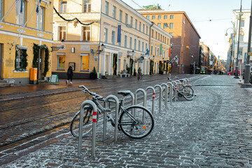 Fototapeta premium Helsinki, Finland November 20, 2020 Downtown Helsinki, Senate Square, bicycles covered in snow, sunny day in November.