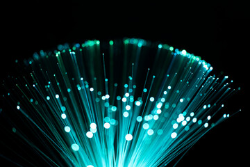 Fiber optic abstract neon lights colorful background. Close up view with bokeh. Glowing optical...