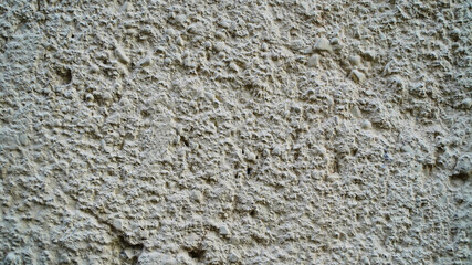Texture and background for the material. Unique pattern of gray cement texture in the pimples of the wall.