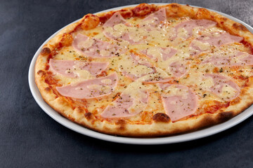 fresh pizza on the white plate
