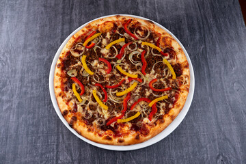 fresh pizza on the white plate