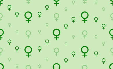 Seamless pattern of large and small green venus symbols. The elements are arranged in a wavy. Vector illustration on light green background