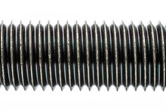 A background made of a macro shot of a black HF bolt thread with a hardness of 4.8, isolated on a white background.
