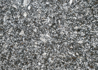 Background from old gray granite natural stone texture. Polished surface, copy space.