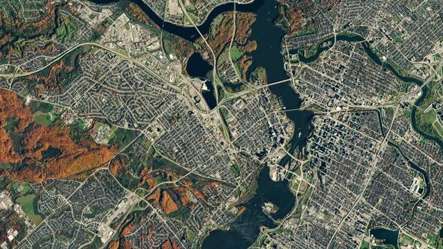 City and river scenic satellite aerial view of Ottawa, Canada, autumnal landscape rotating zoom out with clouds animation. Images furnished by Nasa