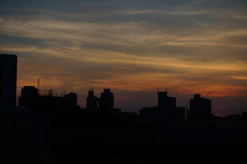 Fototapeta na wymiar Manila Sunset on top of a commercial building