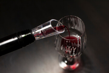 Red wine glass on the dinner table. Liquid concept design. Wine tasting at home