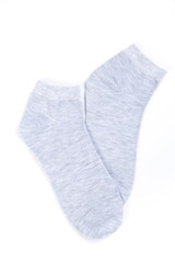 Pair of light gray short socks on a white background, top view
