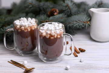Glass cup of brown cocoa with marshmeloy christmas tree, winter hot drink