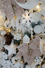 beautiful white Christmas tree decorated with toys close up
