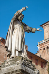 Ferrara - The statue of dominican medieval reformer Girolamo Savanarola in front of castle Castello...