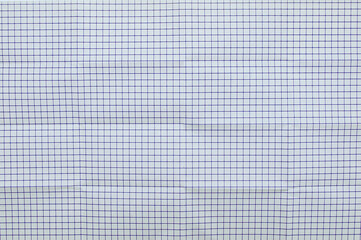 A sheet of paper in cage with folds vertically and horizontally.