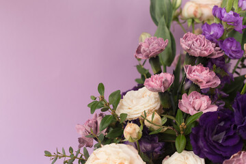 Bouquet in lilac tones on a purple background.