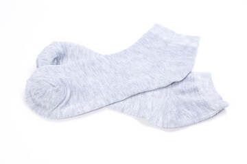 Pair of light gray short socks on a white background, top view