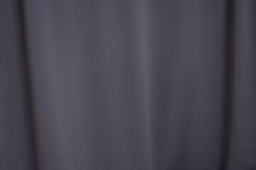 Gray background of wavy curtains, texture