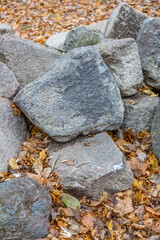 Untreated rough natural stone in everyday environment, gardening and landscaping