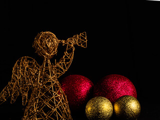 ANGEL ANNOUNCER ON BLACK BACKGROUND WITH CHRISTMAS BALLS
