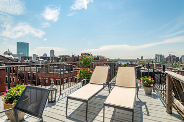 Fototapeta premium A roof deck looks down on Beacon Hill and the Boston skyline