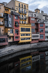 Fototapeta na wymiar Colorful houses with reflections on the river