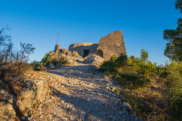 Ruins of fortress on the top of hill in Skradin, Croatia. Early morning, september 2020