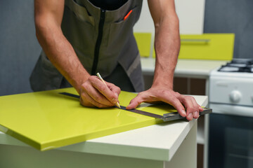 furniture assembling concept close up. building a new kitchen furniture