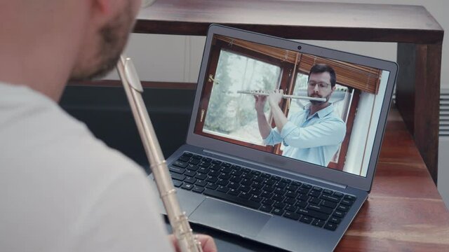 music teacher train online lessons on playing a wind instrument on a flute