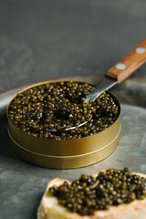 Black caviar, baguette, vertical, close, black, selective focus