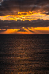 Fototapeta premium Rocky beach in Cobeta Fuma, Alicante, Spain, at sunrise
