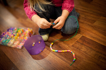 Little Girl Playing with Beads and String, Early Learning, Fine Motor Skills