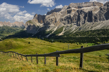 Fototapeta na wymiar Sella group, plateau-shaped mountain massif in the Dolomites, north of the Marmolada and east of Sasso Lungo, seen from the trail to Sella pass & Sella refuge from Comici refuge, South Tyrol, Italy.