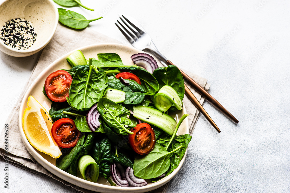 Wall mural spinach salad with sesame seeds