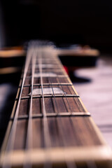 Rosewood neck six string guitar long perspective close up still
