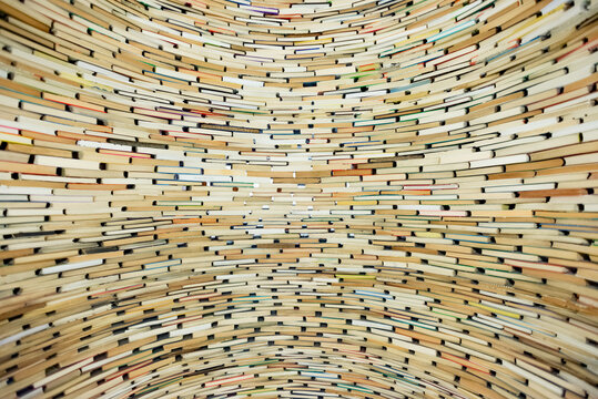 Wall of books. Well made from books. Stack of books.