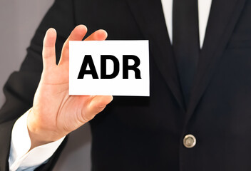 Doctor holding a card with text ADR Adverse drug reaction, medical concept