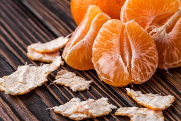 Mandarine orange or tangerine on wooden board