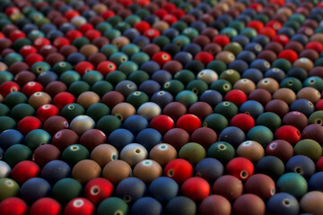 Set of opaque and many-coloured beads looking like mini Christmas balls. Seed beads for use in necklaces and bracelets.
