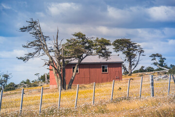 Farm house by the Tierra del Fuego landscape at Patagonia.