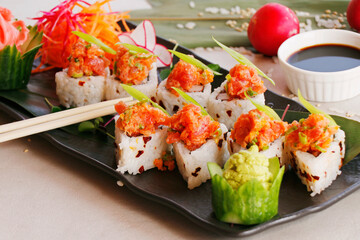japanese sushi rolls with tuna, salmon and soy sauce