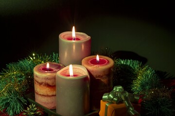 Close up view of Christmas burning candles and decoration objects. Postcard. Christmas and New Year holidays concept background.
