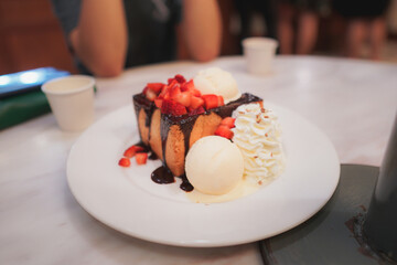 Honey toast with strawberry and vanilla ice cream