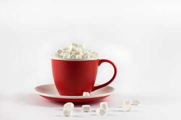 Red marshmallow cup. Christmas food and drink concept. Red cup with marshmallows. Isolate. Copyspace