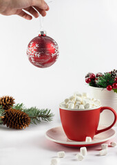 Flatley Christmas. Festive Christmas background. New Year's and Christmas. Christmas red ball, marshmallow in a red cup. isolate. Banner. copyspace