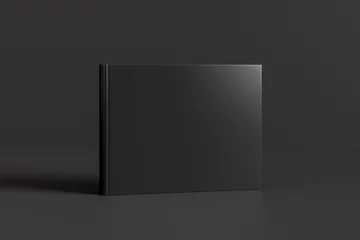 Abwaschbare Fototapete Grau 2 Gebundenes horizontales oder querformatiges schwarzes Mockup-Buch, das auf schwarzem Hintergrund steht.