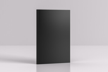 Hardcover vertical black mockup book standing on the white background.