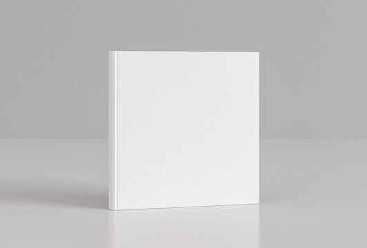 Hardcover square white mockup book standing on the white background.